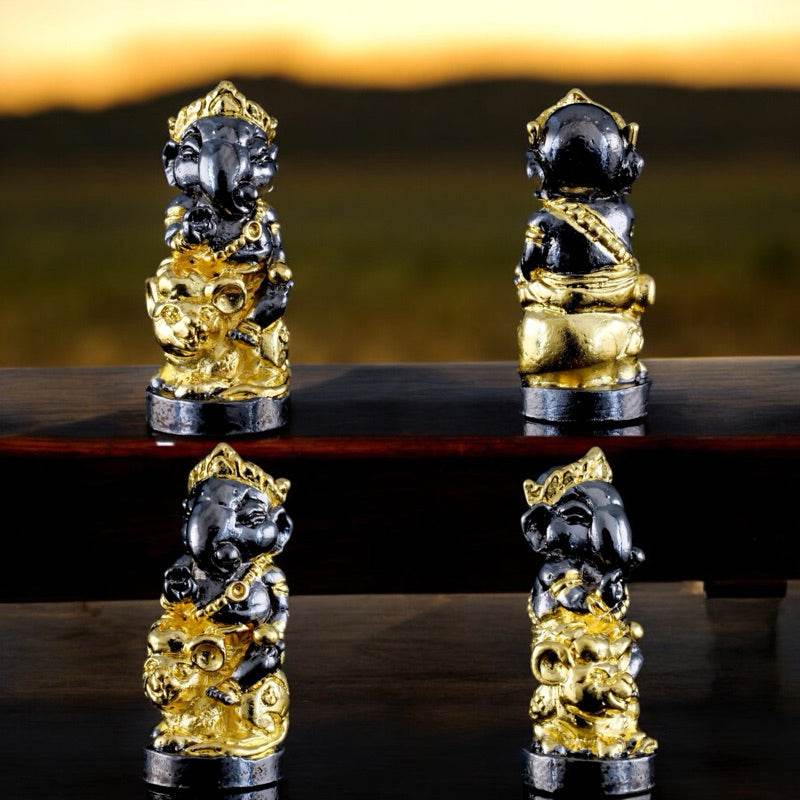 Ganesha blessing amulet Thailand in black and gold by Thai Blessing Co displayed from multiple angles