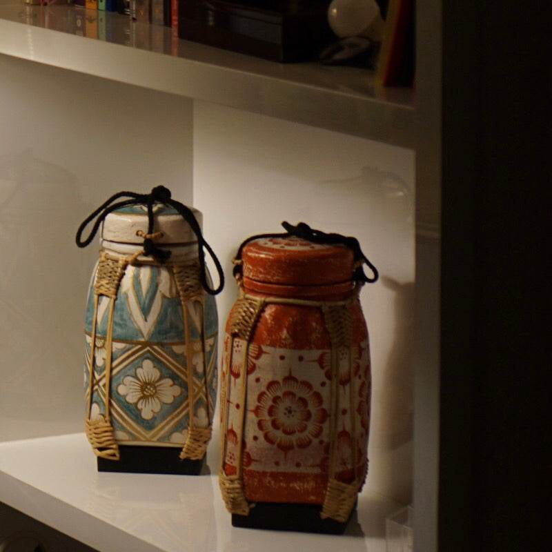 Handmade lanna bamboo rice box set with traditional floral patterns in blue and red colors