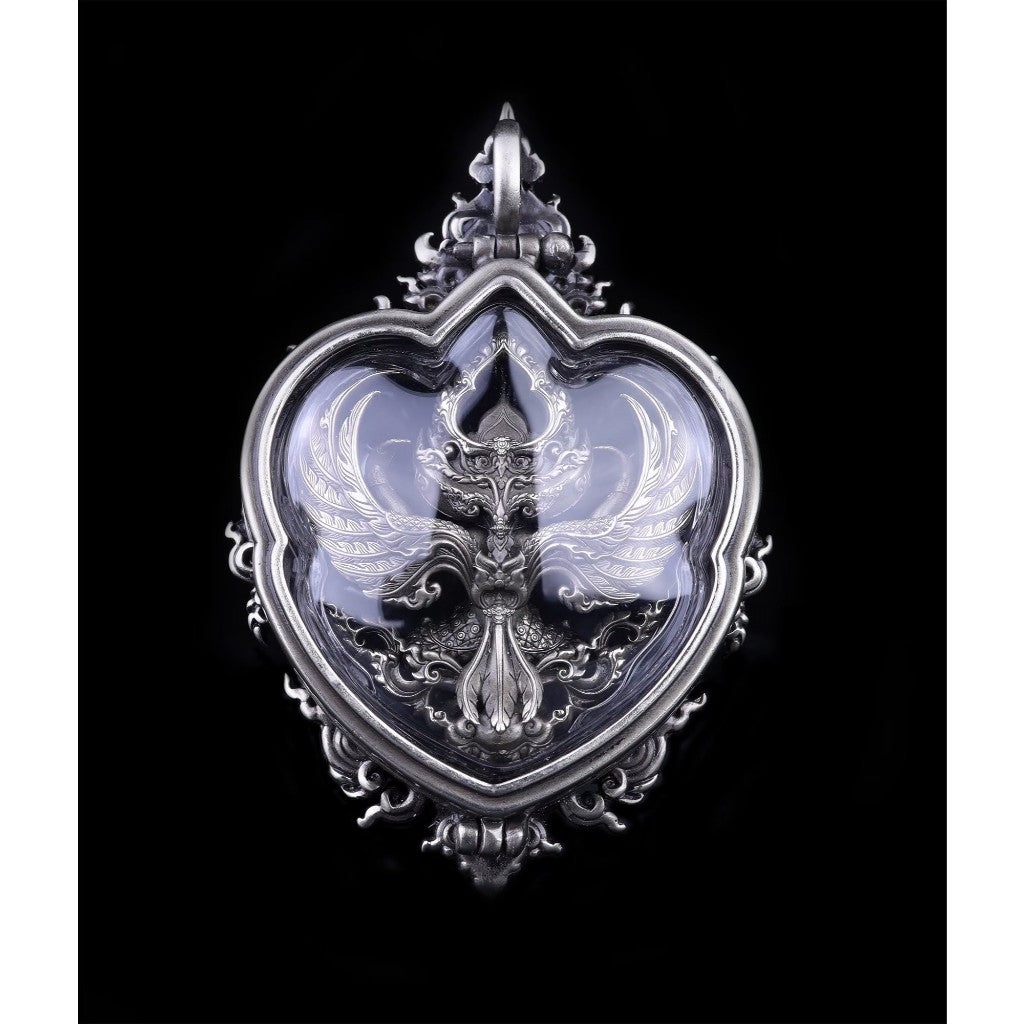 Elegant Garuda amulet for wealth and protection in a decorative silver frame with intricate designs