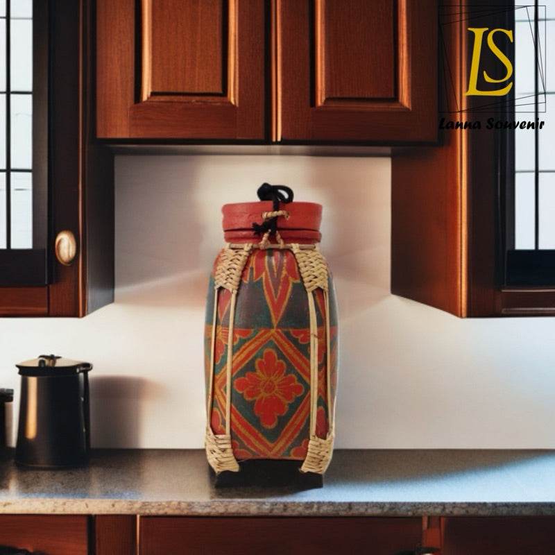 Handmade lanna bamboo rice box with traditional decorative patterns on kitchen countertop