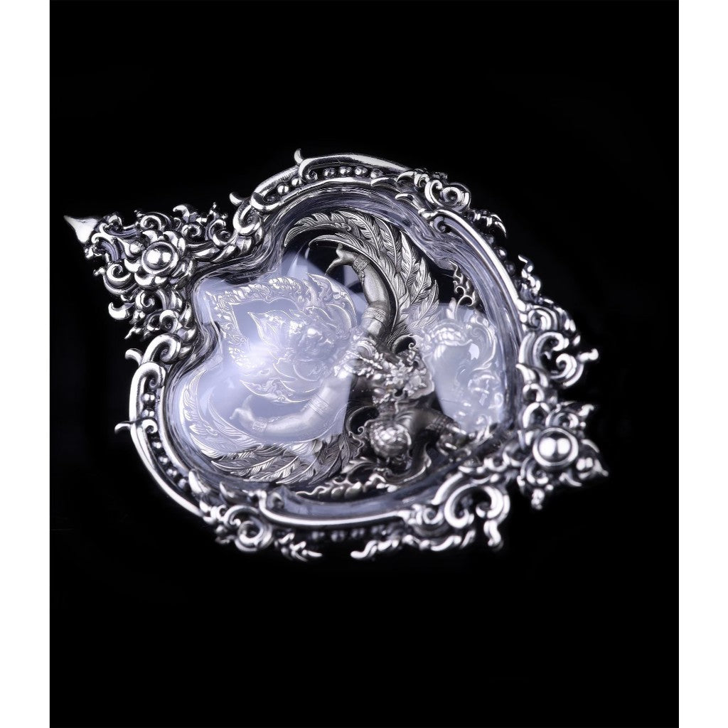 Intricately designed Garuda amulet for wealth and protection featuring silver accents and detailed craftsmanship