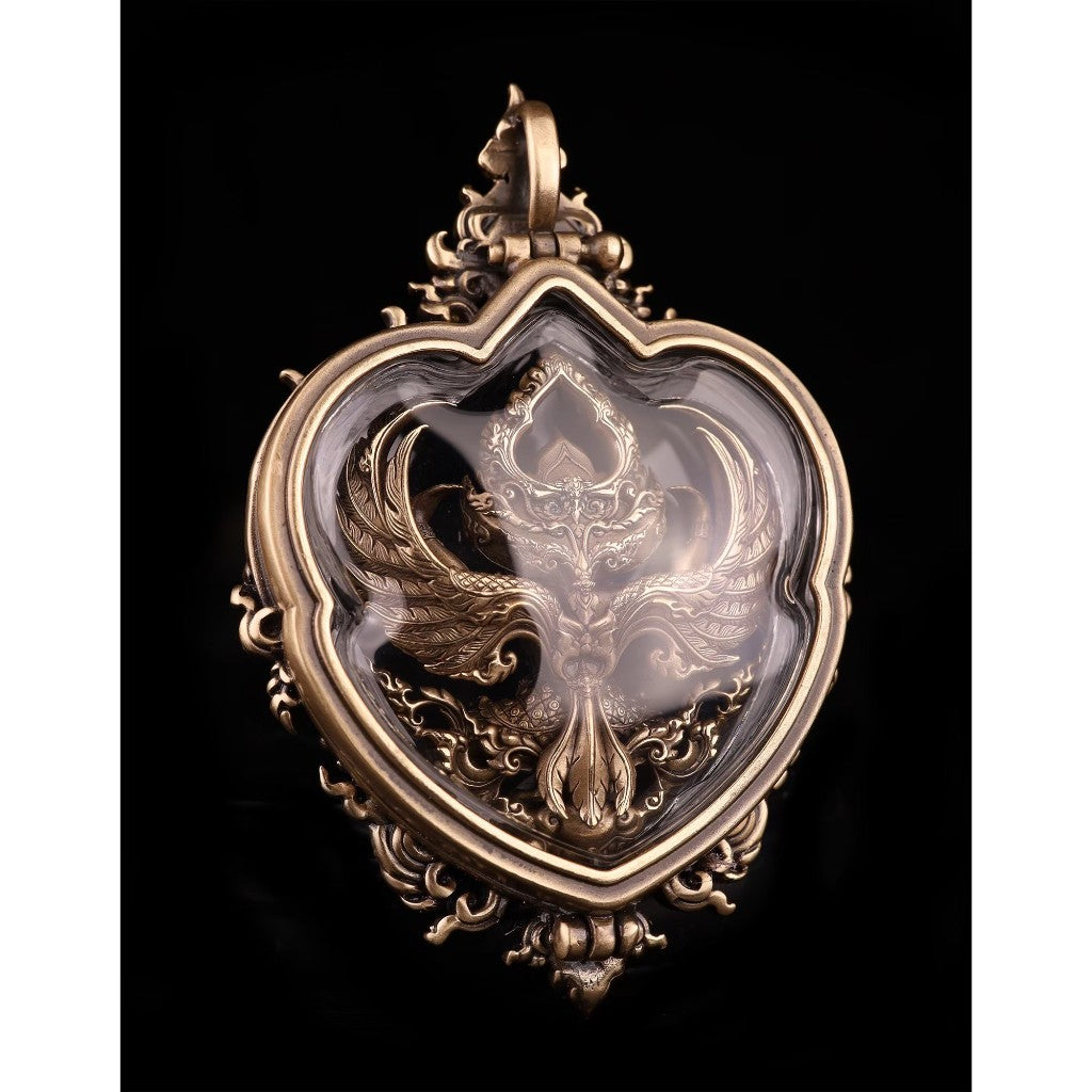 Bronze Garuda amulet for wealth and protection encased in a heart-shaped decorative frame