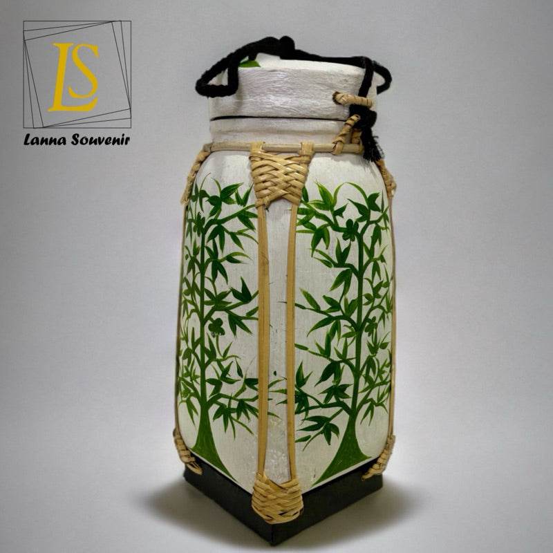 Handmade lanna bamboo rice box with green bamboo leaf design and traditional weaving details