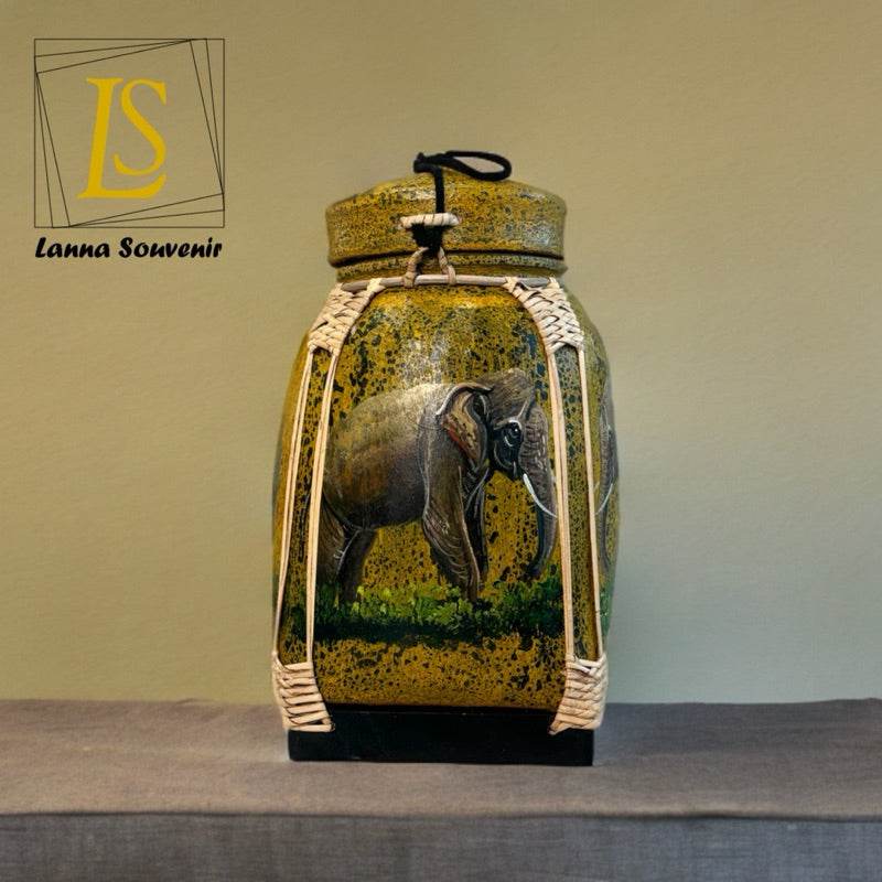 Lanna style bamboo storage box with elephant design and woven detailing on beige background