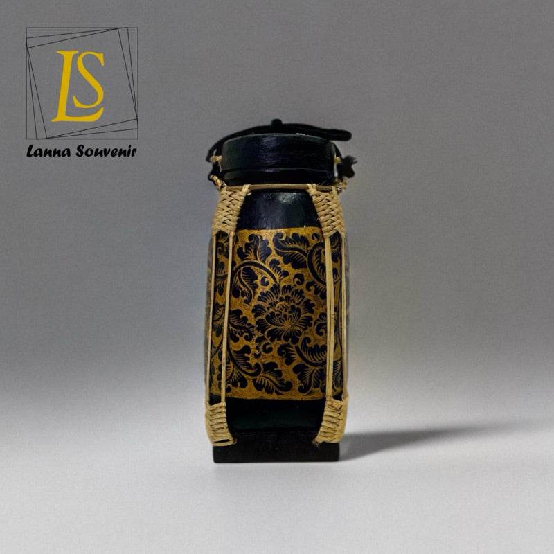 Handmade Lanna bamboo rice box with intricate golden floral design and black accents for food storage