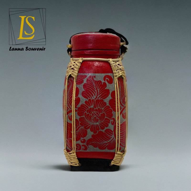 Handmade lanna bamboo rice box with red floral design and natural woven bamboo frame
