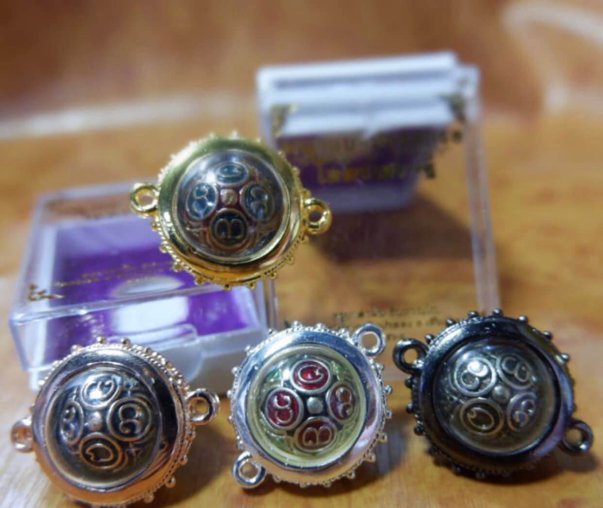 Thai Blessing Co ancient mercury spirit orb pendants in gold silver black and copper ornamental amulet set