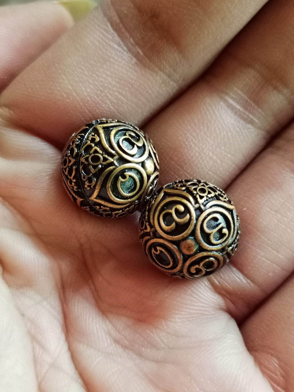 Thai Blessing Co ancient mercury spirit orb pair bronze filigree spheres held in hand for feng shui