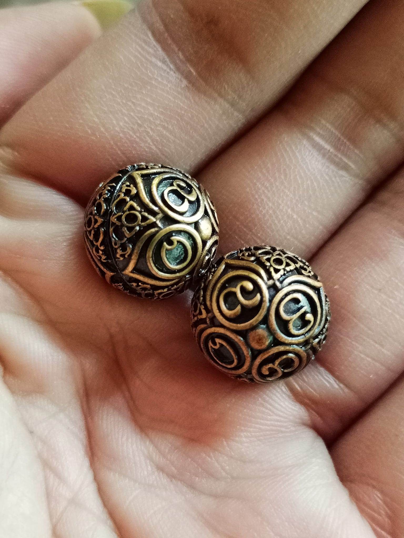 Thai Blessing Co ancient mercury spirit orb pair bronze filigree spheres held in hand for feng shui