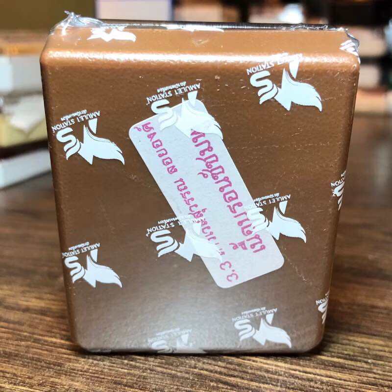 Thai Blessing Co packaged brown box with sticker containing giant king amulet wealth bringer for home altar