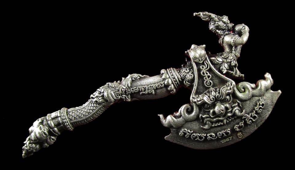 Intricate silver Great Axe Amulet Maha Prap with Thai script engravings and ornate handle ornamentation