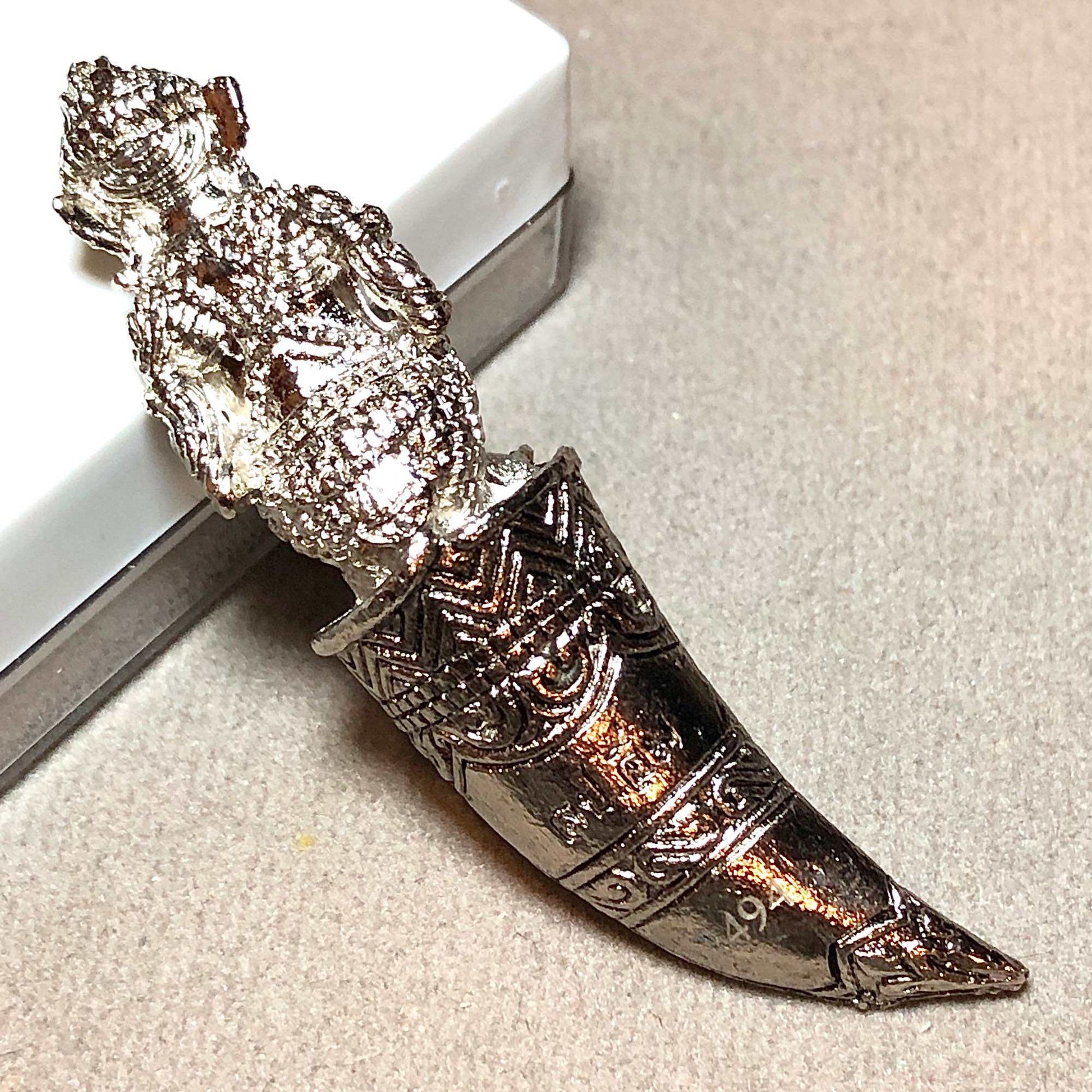 Hanuman Sitting on Fangs silver amulet pendant with engraved horn design and ornate detailing