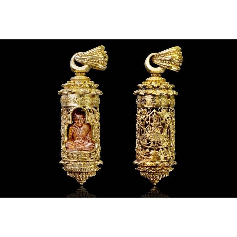 Khun Setthi Takrud longevity amulet gold cylindrical pendant with seated monk figure and ornate filigree