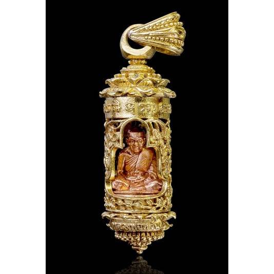 Khun Setthi Takrud longevity amulet gold cylindrical pendant with seated monk statue and ornate filigree