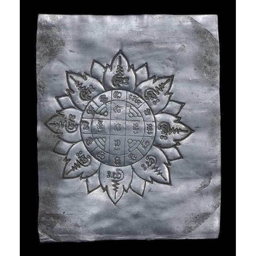 Lead yantra amulet sheet engraved with lotus design and Thai script lead takrut blessed by Luang Pu Paew from Thai Blessing Co