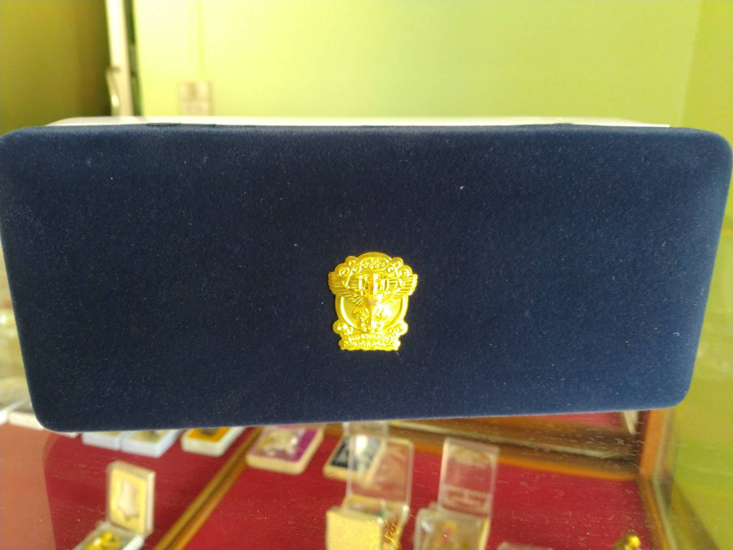 Thai Blessing Co navy velvet presentation box with gold emblem for limited edition Garuda amulet set