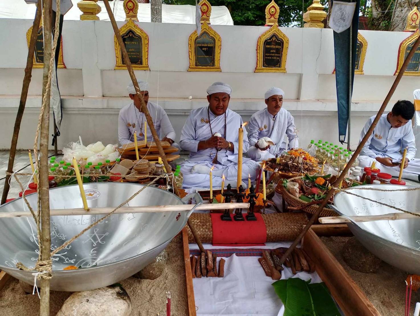 Luuk Sawat sacred charm Thai blessing ceremony with white robed monks, offerings and large metal bowls