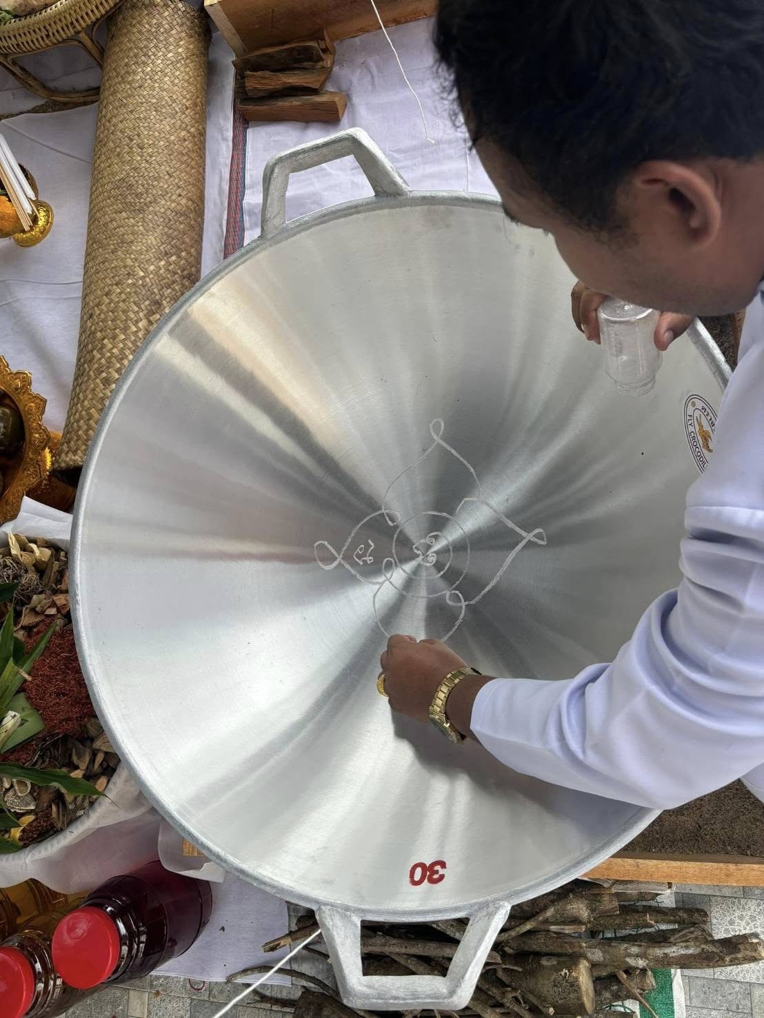 Thai Blessing Co Luuk Sawat sacred charm blessing ritual pouring holy water into yantra bowl