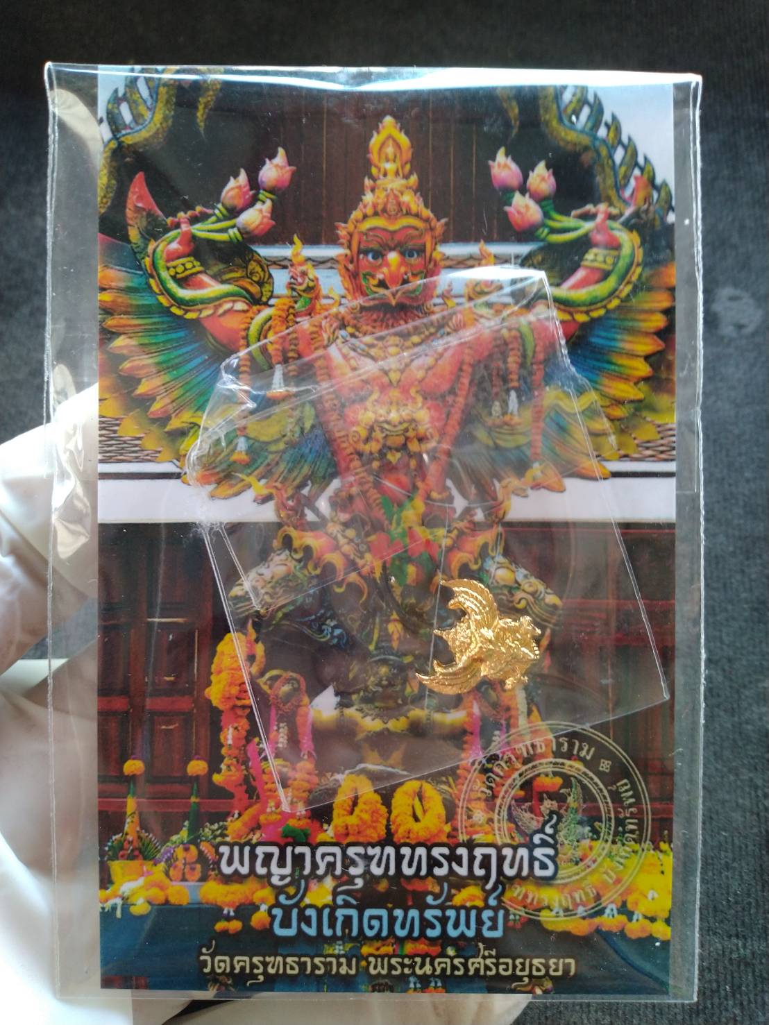 Thai Blessing Co mini Garuda amulet gold tone pendant in clear plastic case with colorful Garuda card
