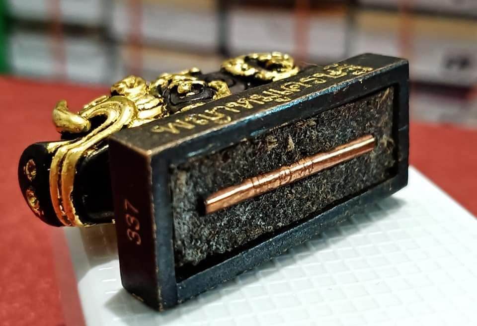 Phaya Moo Setthi amulet bronze and gold pig figure on black rectangular base with copper core