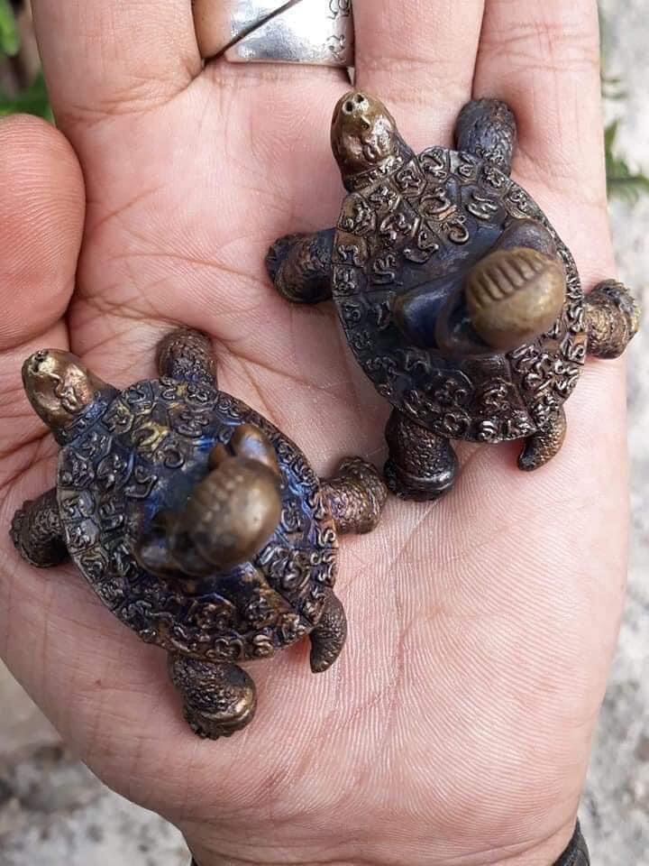 Handheld bronze turtle talismans by Thai Blessing Co Phaya Tao Reuan amulet for wealth ornate pair