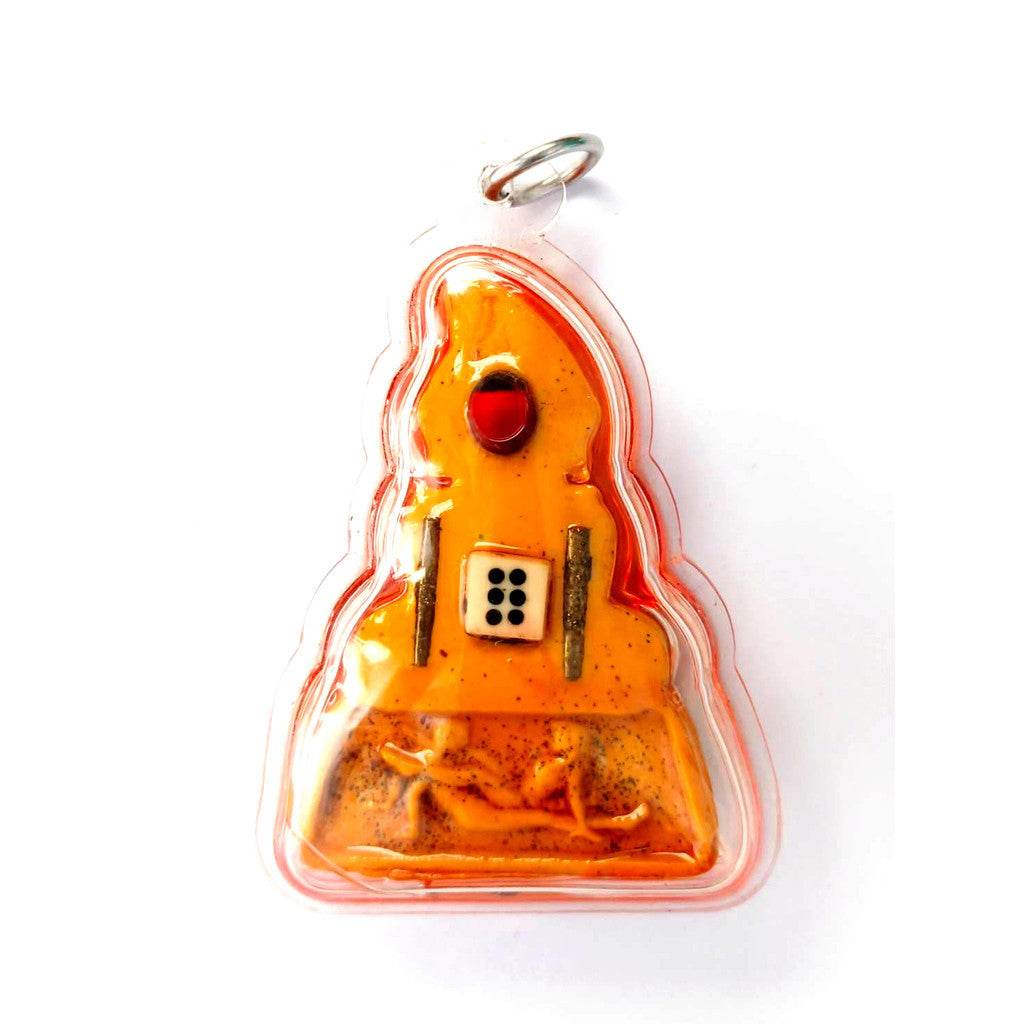 Phra Ngang love charm Thai amulet pendant with red bead and dice symbol in orange resin encased in clear plastic