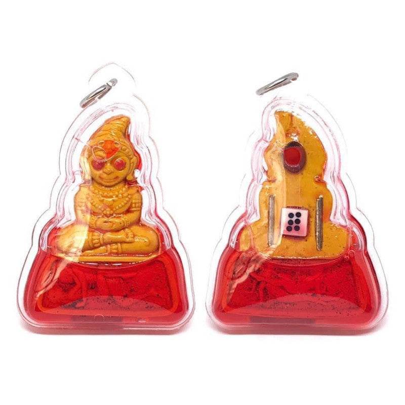 Phra Ngang love charm amulet by Thai Blessing Co gold seated figure in clear case with red base