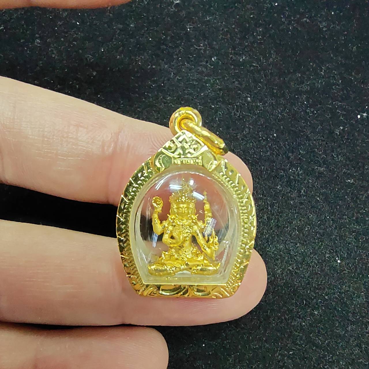 Handheld Phra Phrom amulet gold case pendant with clear dome and detailed four faced deity figure