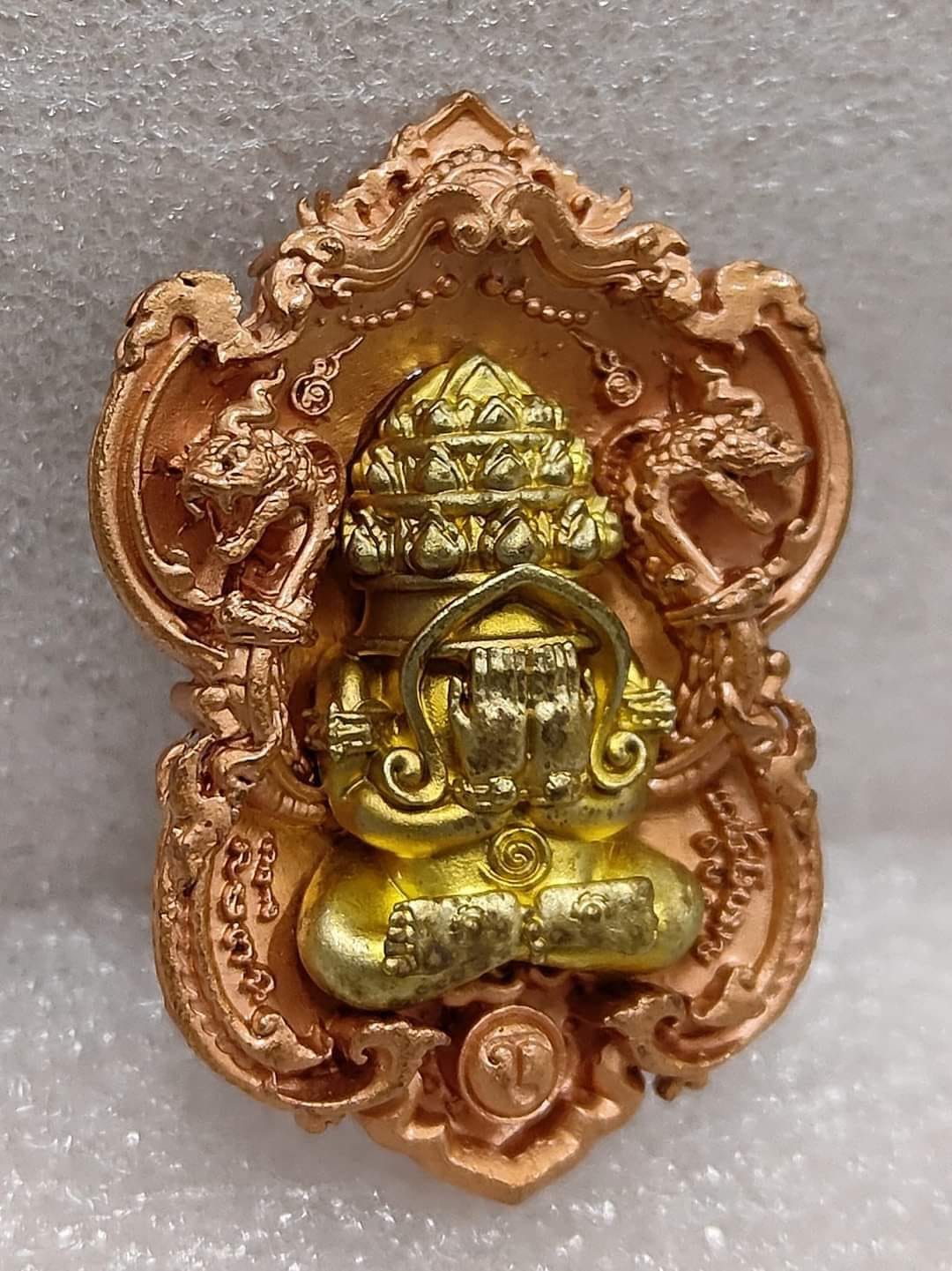 Thai Blessing Co Phra Pidta amulet for wealth gold and copper ornate pendant with guardian naga motifs