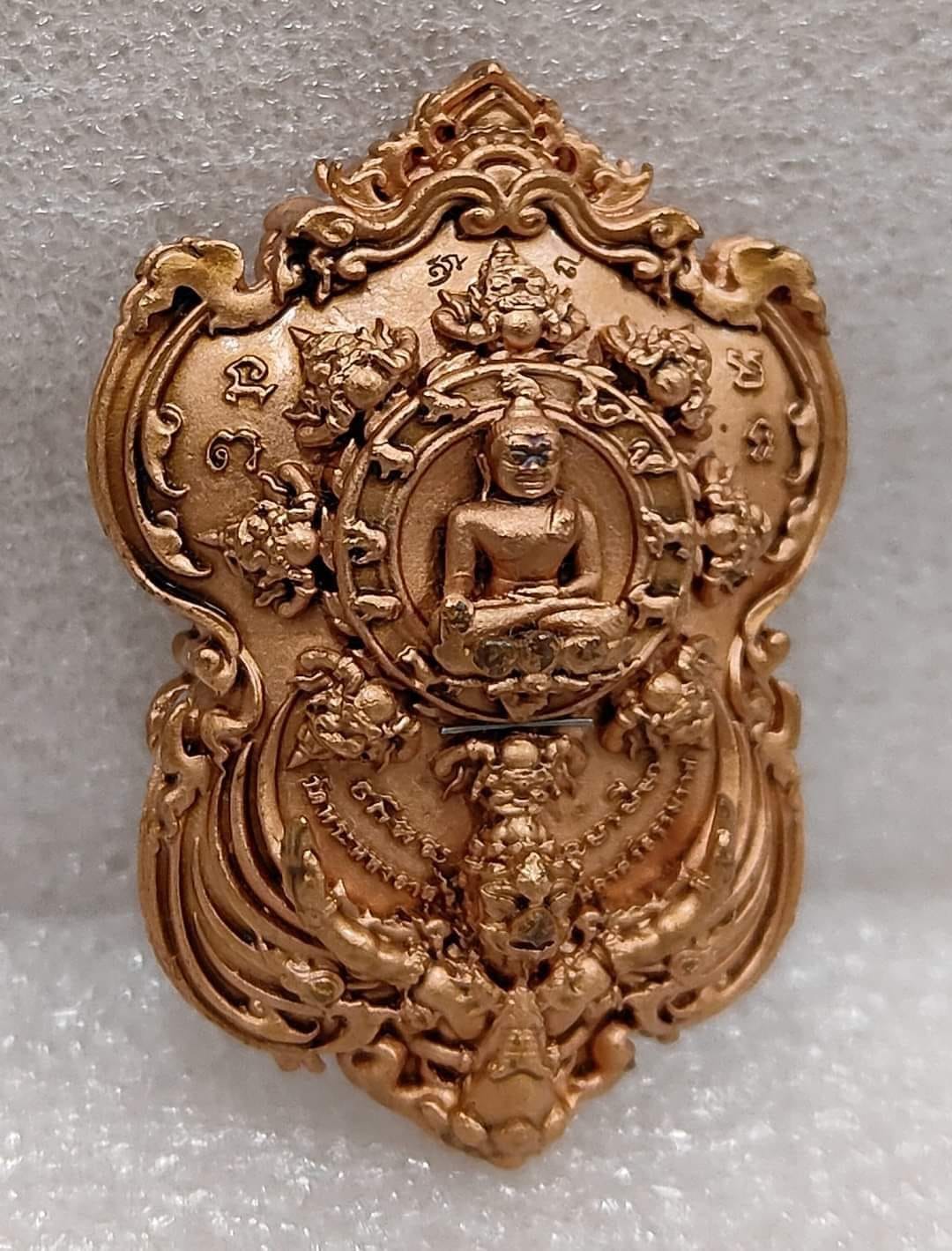 Phra Pidta amulet for wealth ornate gold Thai Buddha pendant with intricate floral and mythical motifs