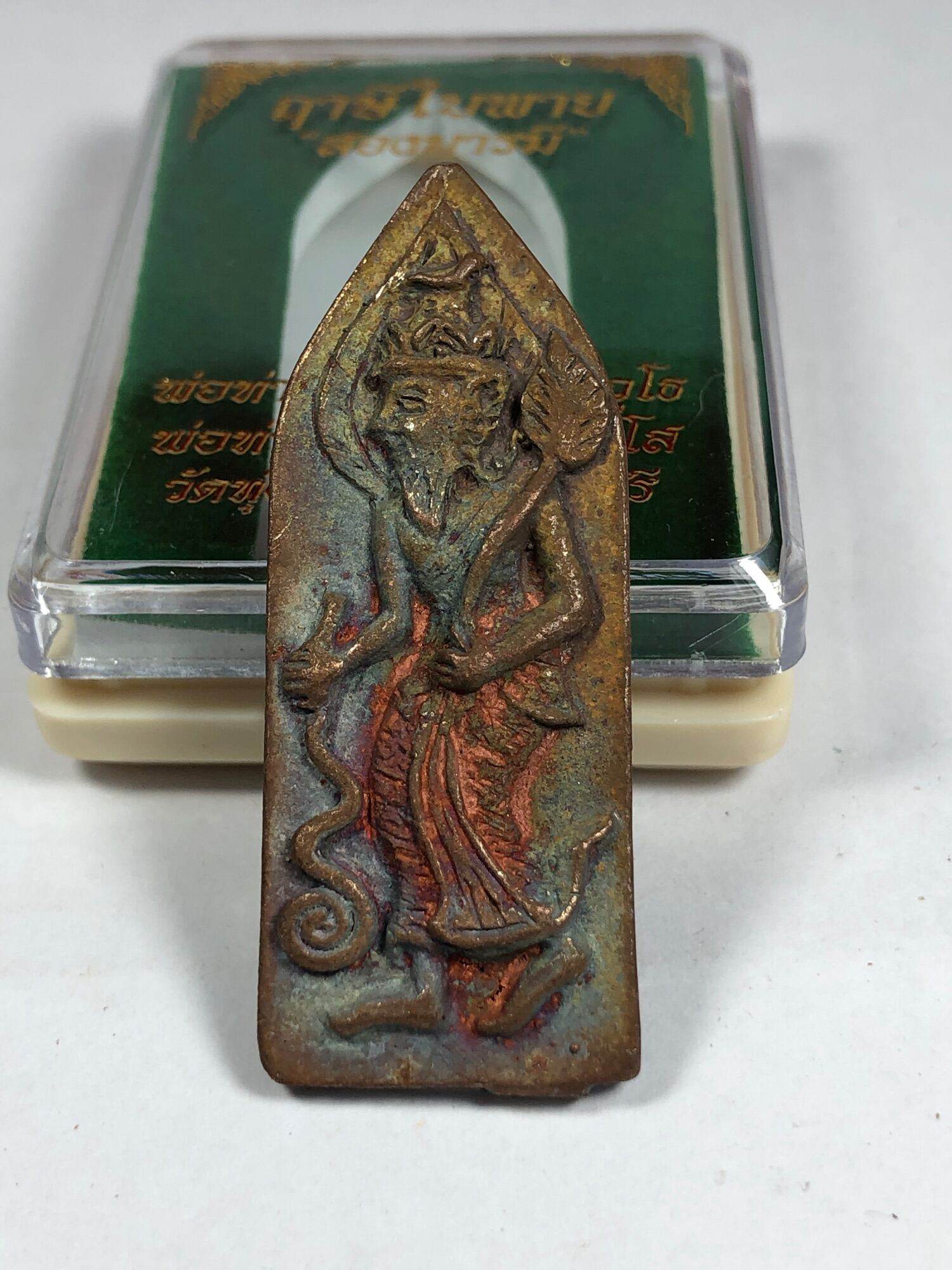Antique brass Ruesi Bai Pai amulet for protection depicting a standing hermit with serpent and staff