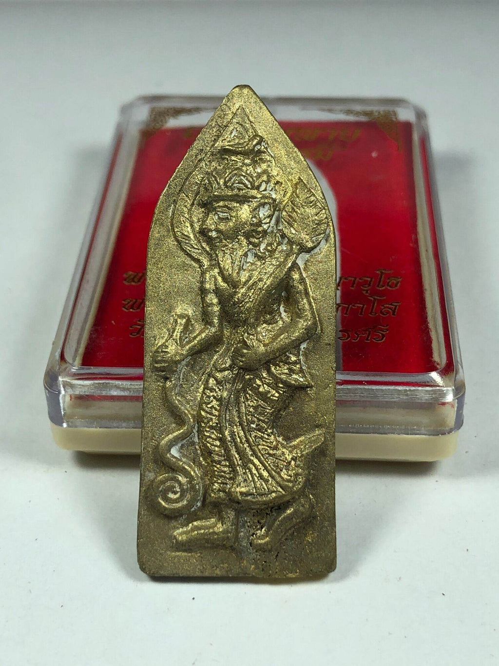 Ruesi Bai Pai amulet for protection gold metal Thai hermit figure standing on base with red case