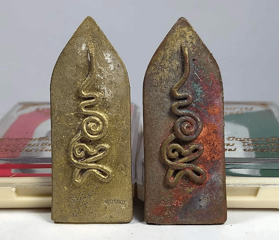 Pair of Thai metal Ruesi Bai Pai amulet for protection plaques with spiral script gold and aged patina finish