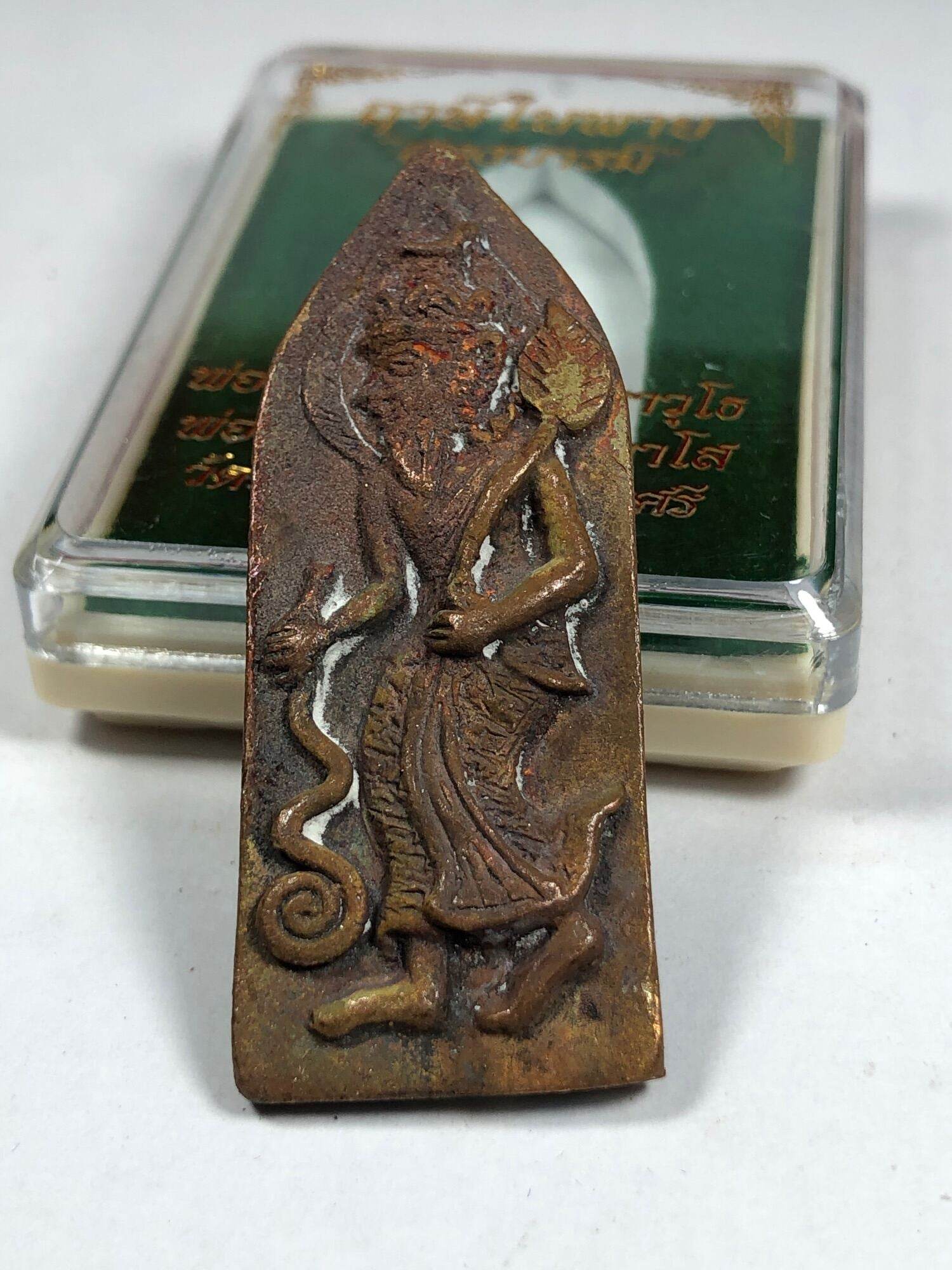 Ruesi Bai Pai amulet for protection bronze Thai hermit figure with aged patina standing in display case