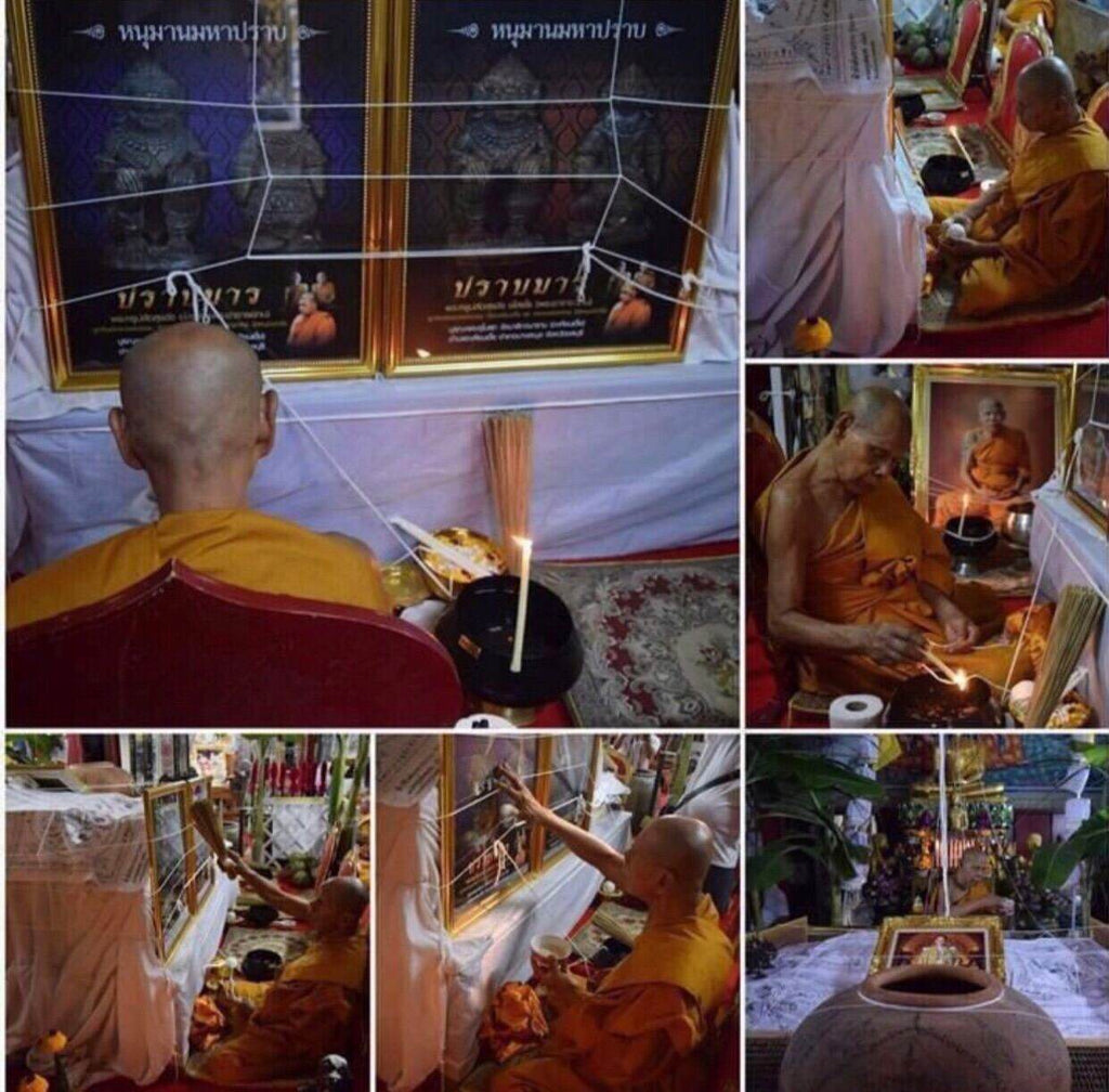 Monks performing blessing ceremony with white thread and incense for Somdej Song Hanuman Amulet in temple
