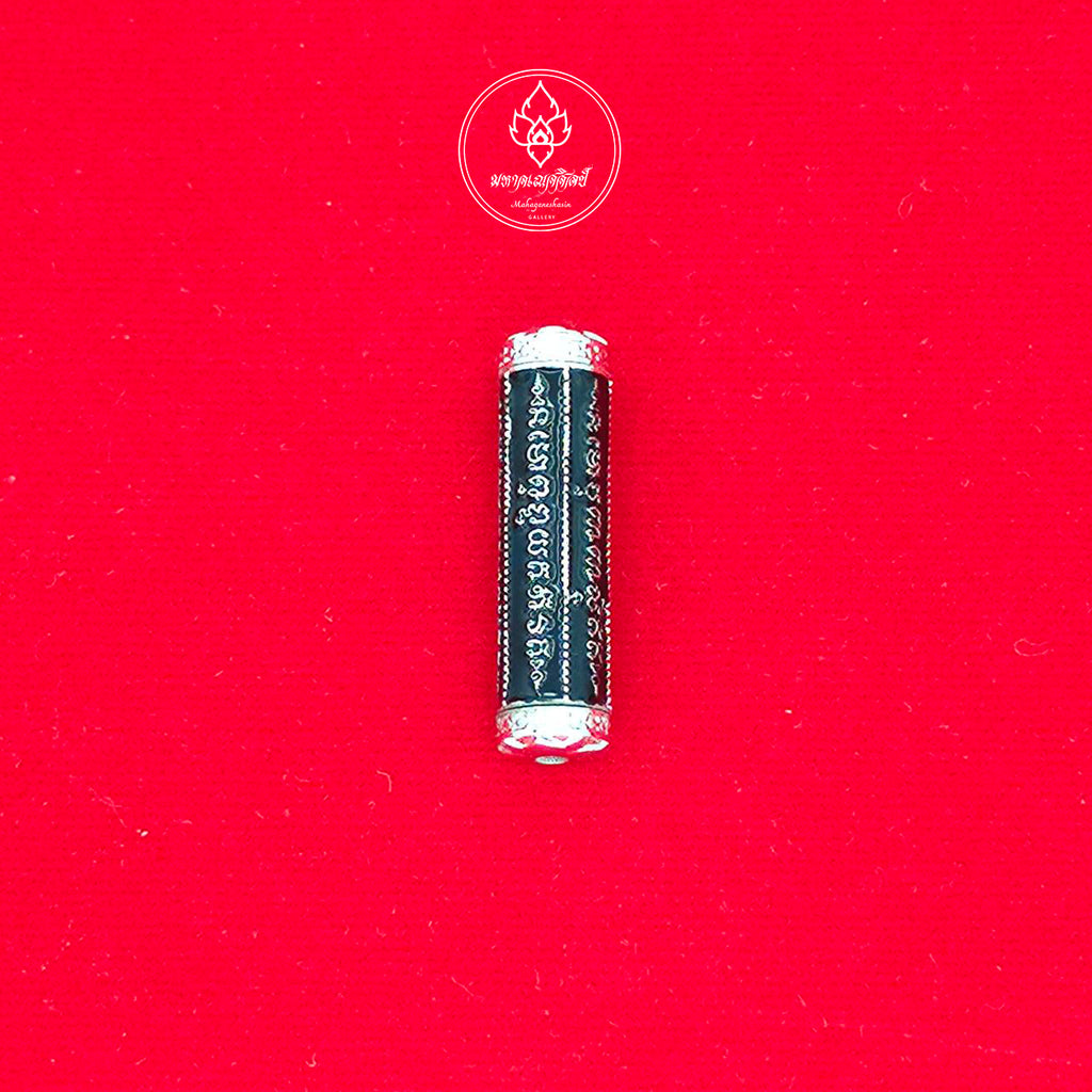 Black cylindrical takrut 5 lines amulet with silver caps and engraved script on red cloth by Thai Blessing Co