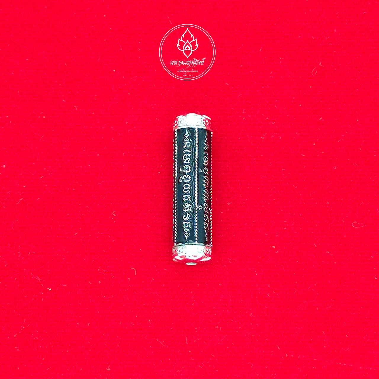 Black cylindrical takrut 5 lines amulet with silver caps and engraved script on red cloth by Thai Blessing Co
