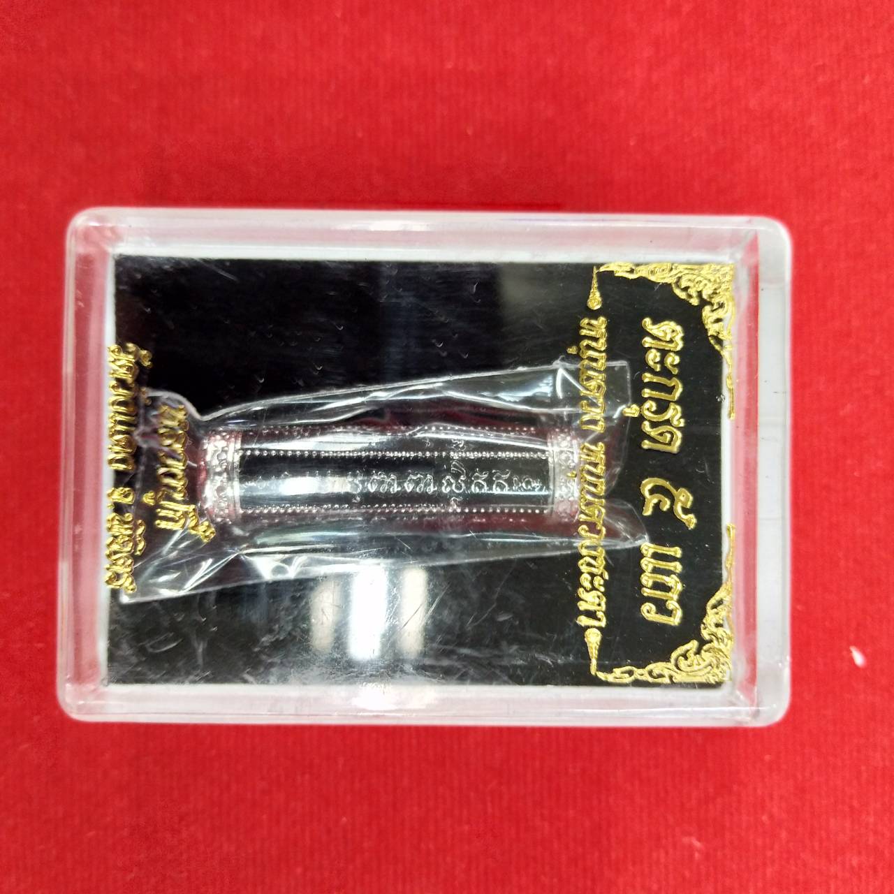 Thai Blessing Co takrut 5 lines amulet in clear plastic display case with black gold label