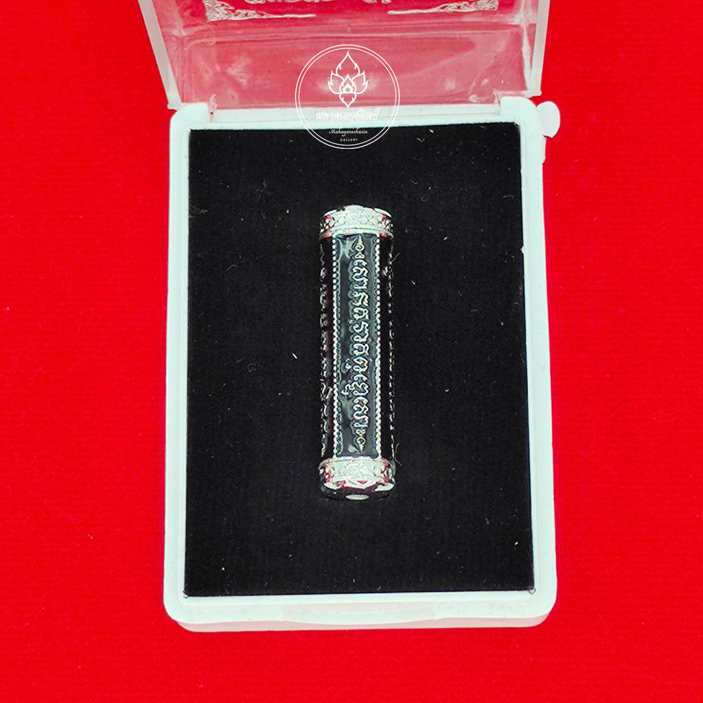 takrut 5 lines amulet black inscribed metal cylinder with silver end caps in clear display box on red background