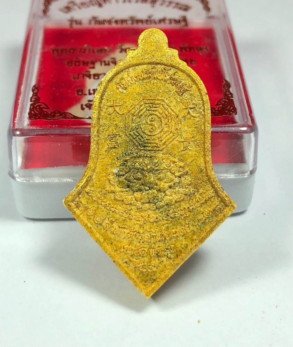 Tao Wessuwan Amulet - Vann Material, Blessed by 12 Esteemed Monks . Gold shield pendant with yantra script on red case