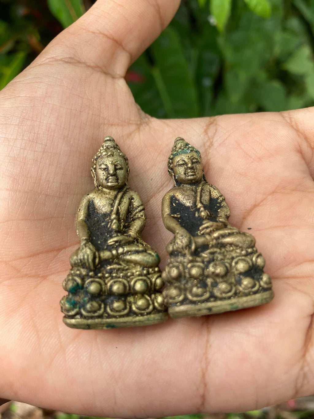 Handheld vintage brass Buddha statuettes pair from Thai Blessing Co small amulets Thai ghost-repelling amulet for protection