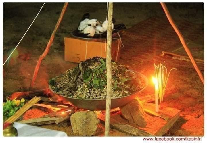 Thai ghost-repelling amulet for protection. Displayed in a traditional ritual offering bowl with candles and herbs