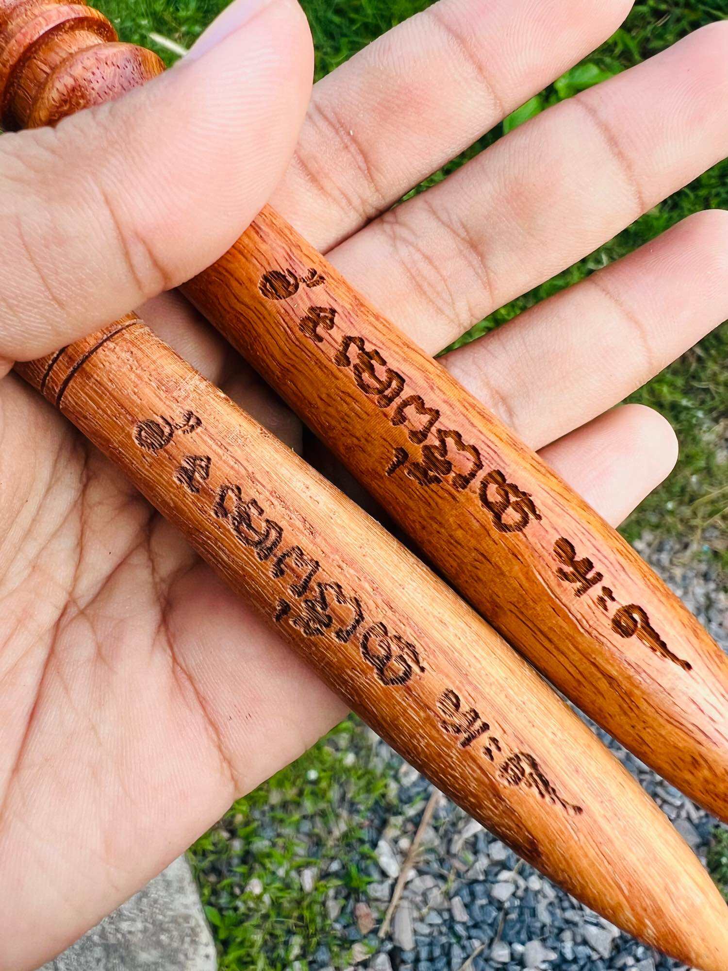 Handheld carved wooden Thai spiritual master stick with sacred script engraving ideal for blessing rituals