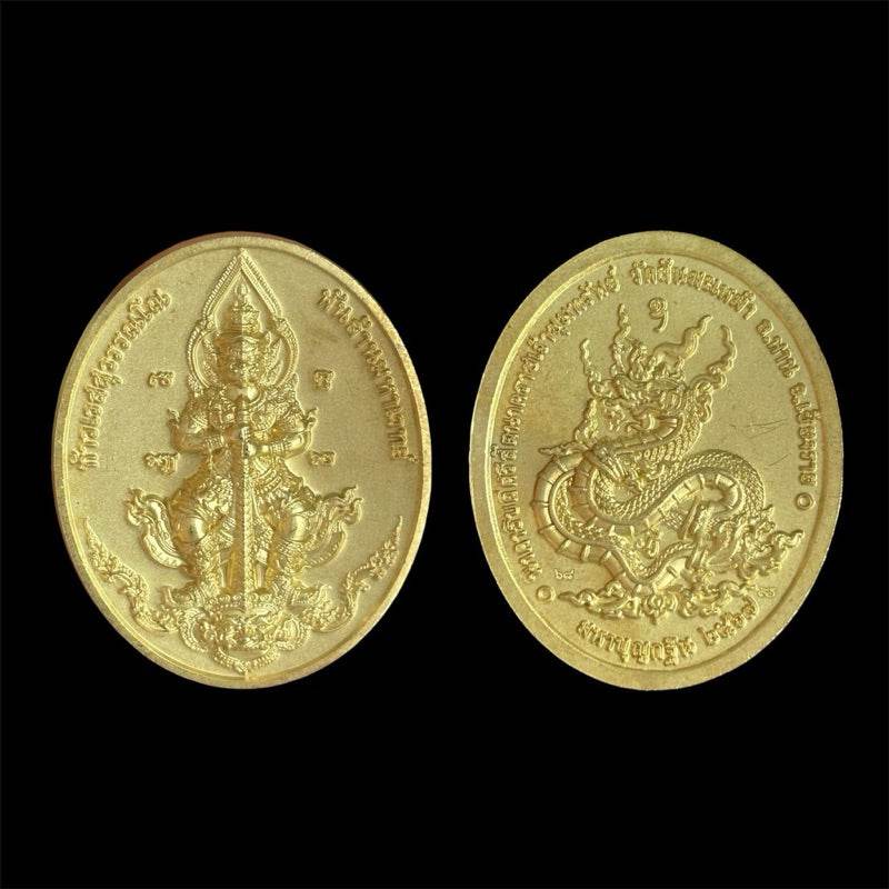 Thao Wessuwan amulet satin brass oval double sided engraved deity and naga serpent Thai blessing talisman