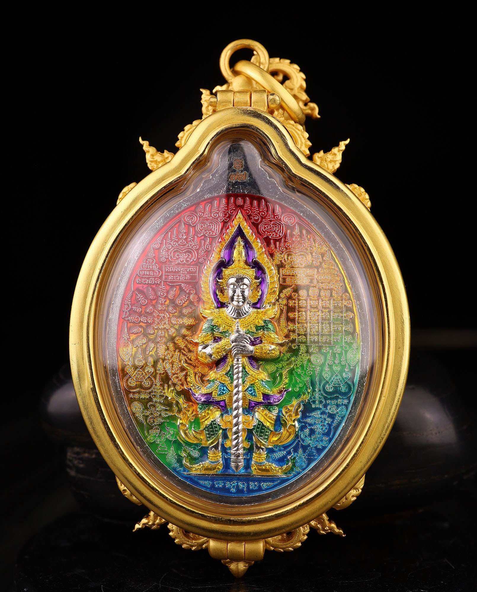 Thai Blessing Co ornate gold oval pendant featuring colorful Thao Wessuwan wealth amulet with guardian deity