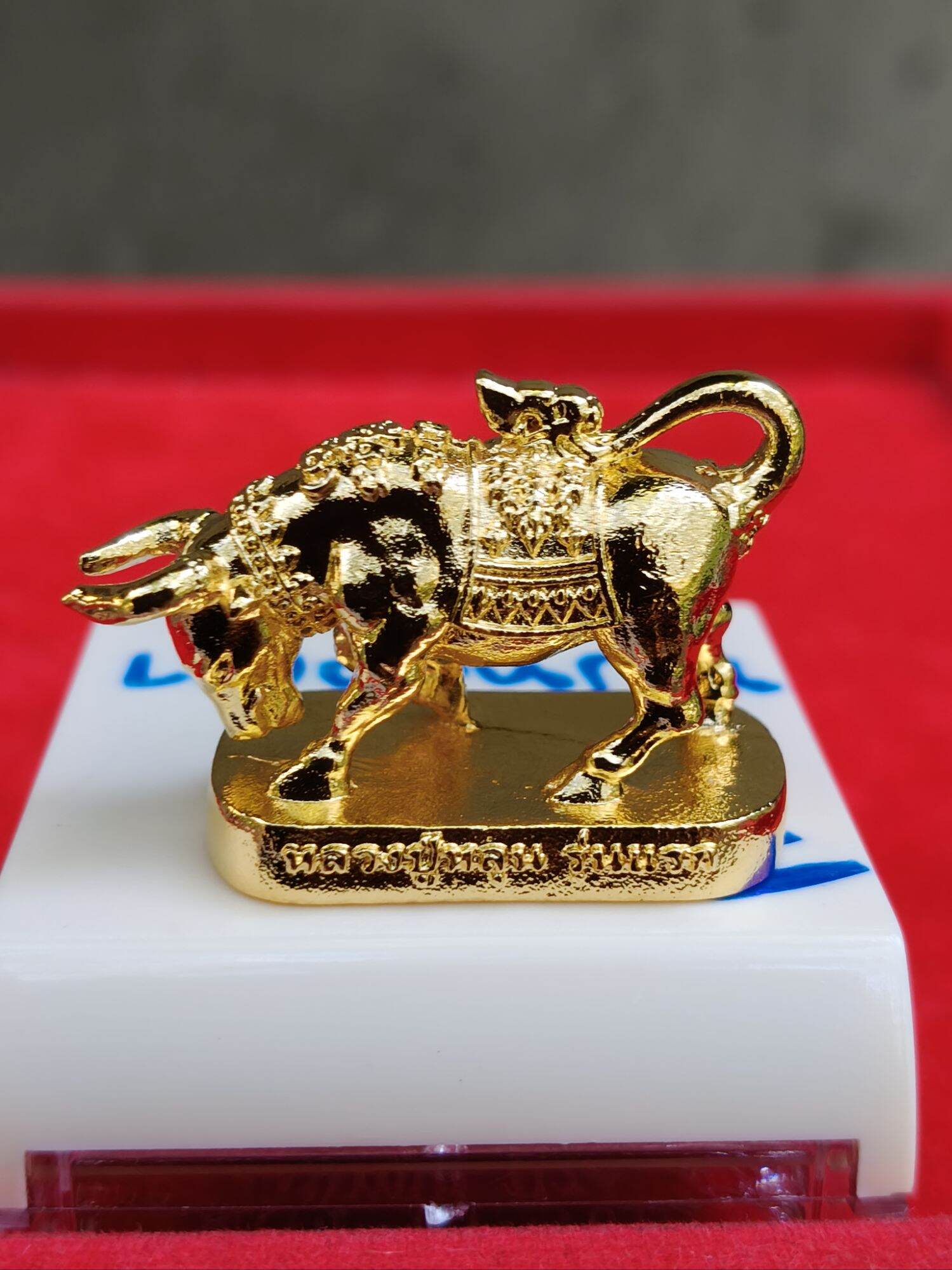 Wua Ta Nhoo sacred bull talisman gold plated amulet figurine on base with ornate Thai saddle and engraving