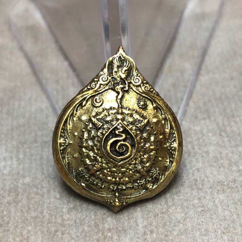 Gold teardrop pendant with intricate Thai lotus and spiral design Phra Phrom Mahasombat blessed amulet by Thai Blessing Co