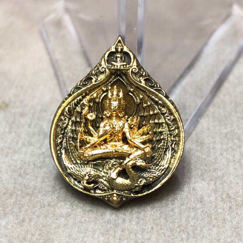 Phra Phrom Mahasombat blessed amulet gold medallion with seated multiarmed deity and ornate wings