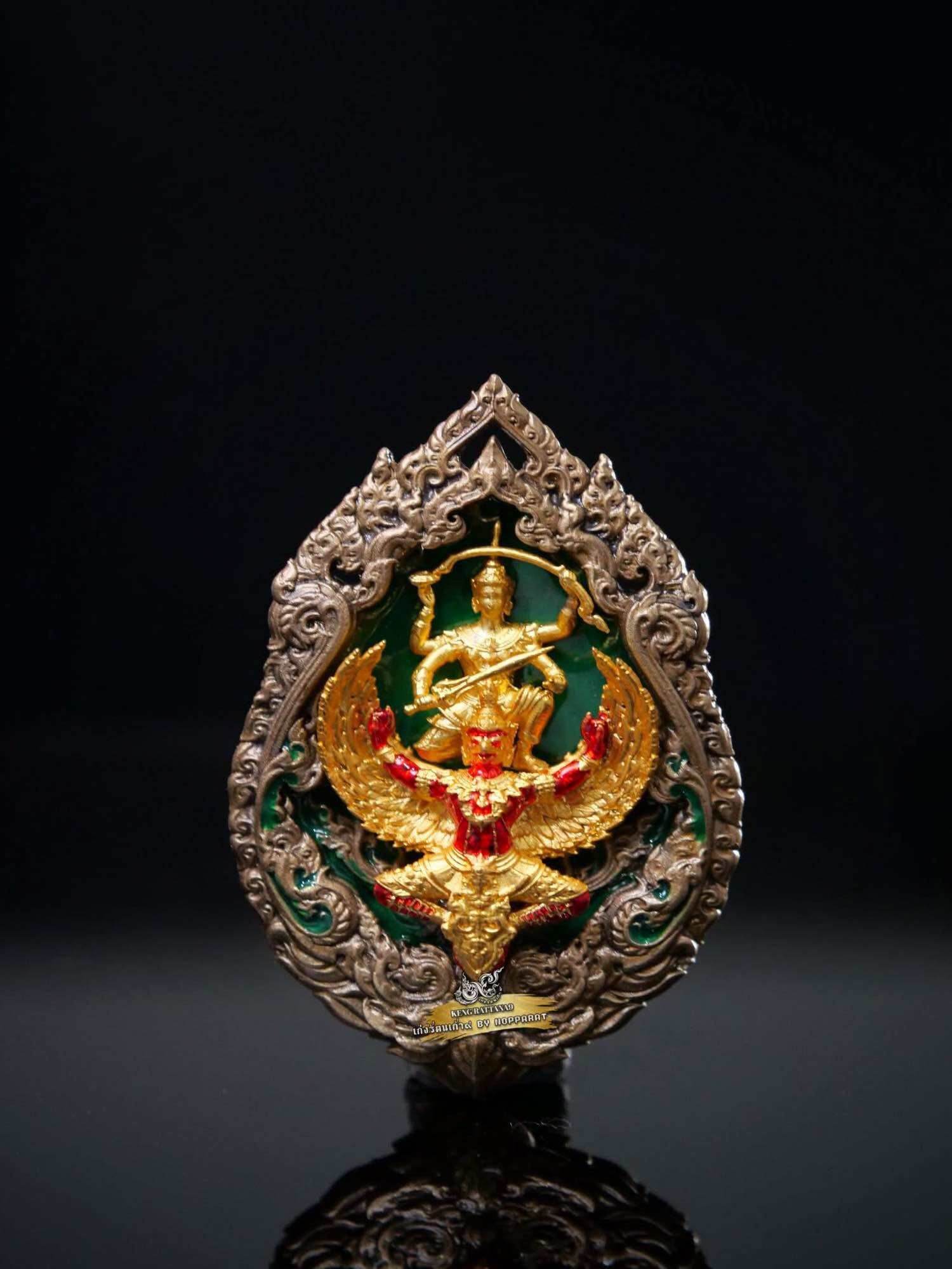 Gold and red Narayana on Garuda Medallion with ornate silver frame and green enamel background