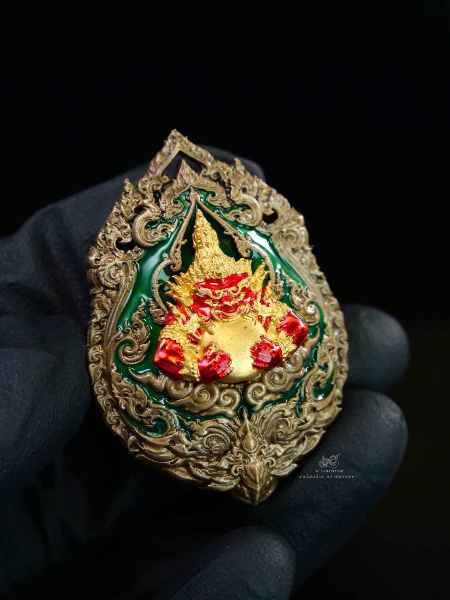 Gold ornate amulet featuring Narayana on Garuda Medallion with green enamel and red deity details